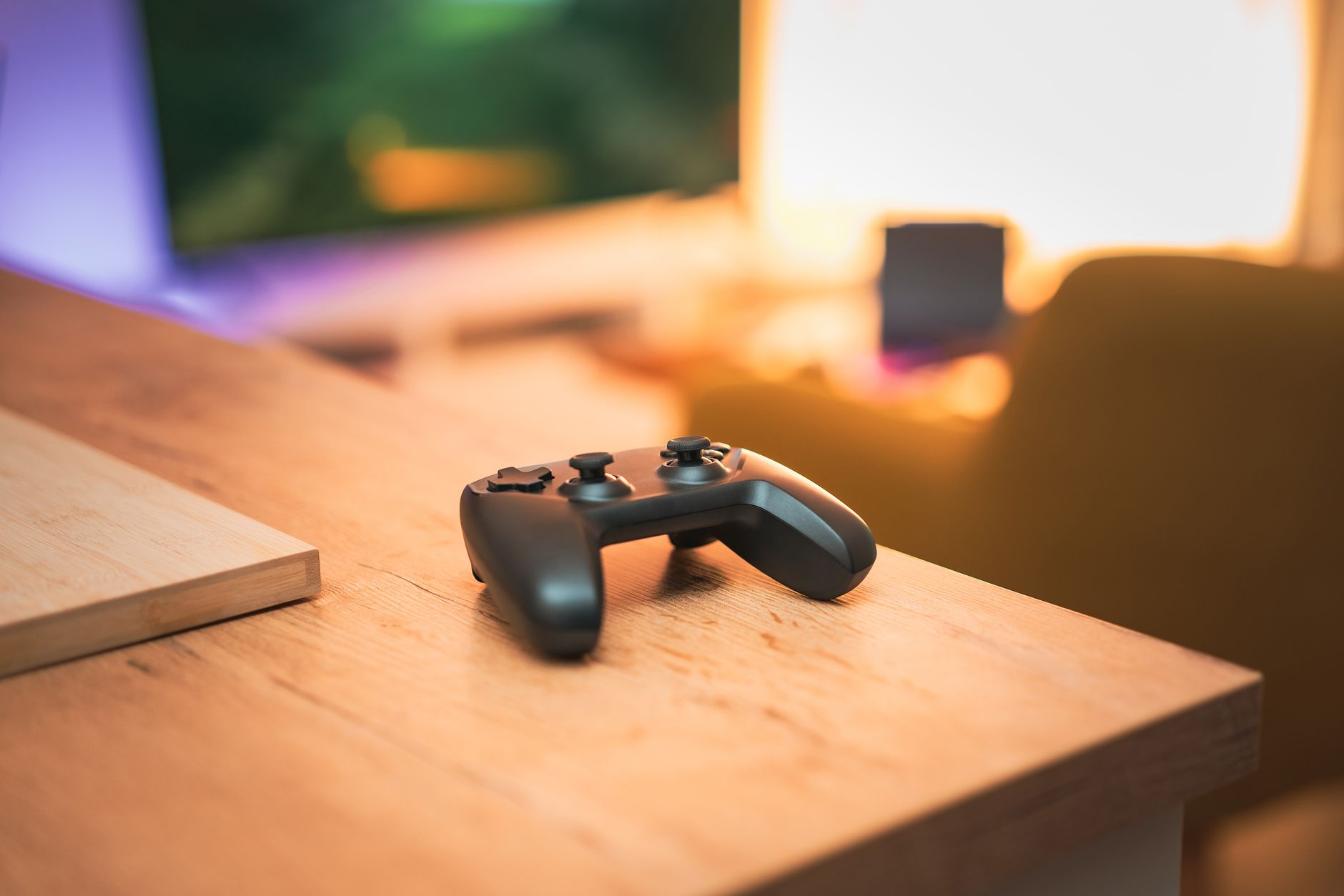 A cozy indoor scene with a video game controller on a desk, perfect for gaming enthusiasts. — How To Win More Free Slots To P