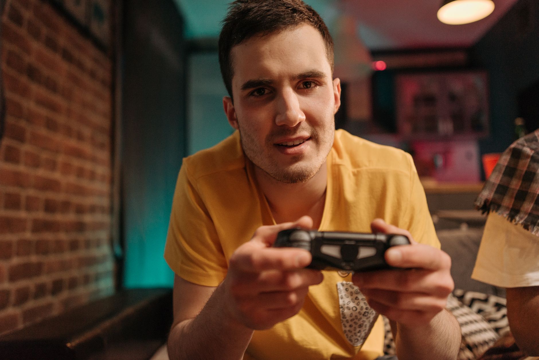 Focused young man enjoying video games with a controller indoors. — mpoid alternative link - Verified Backup Access Link for