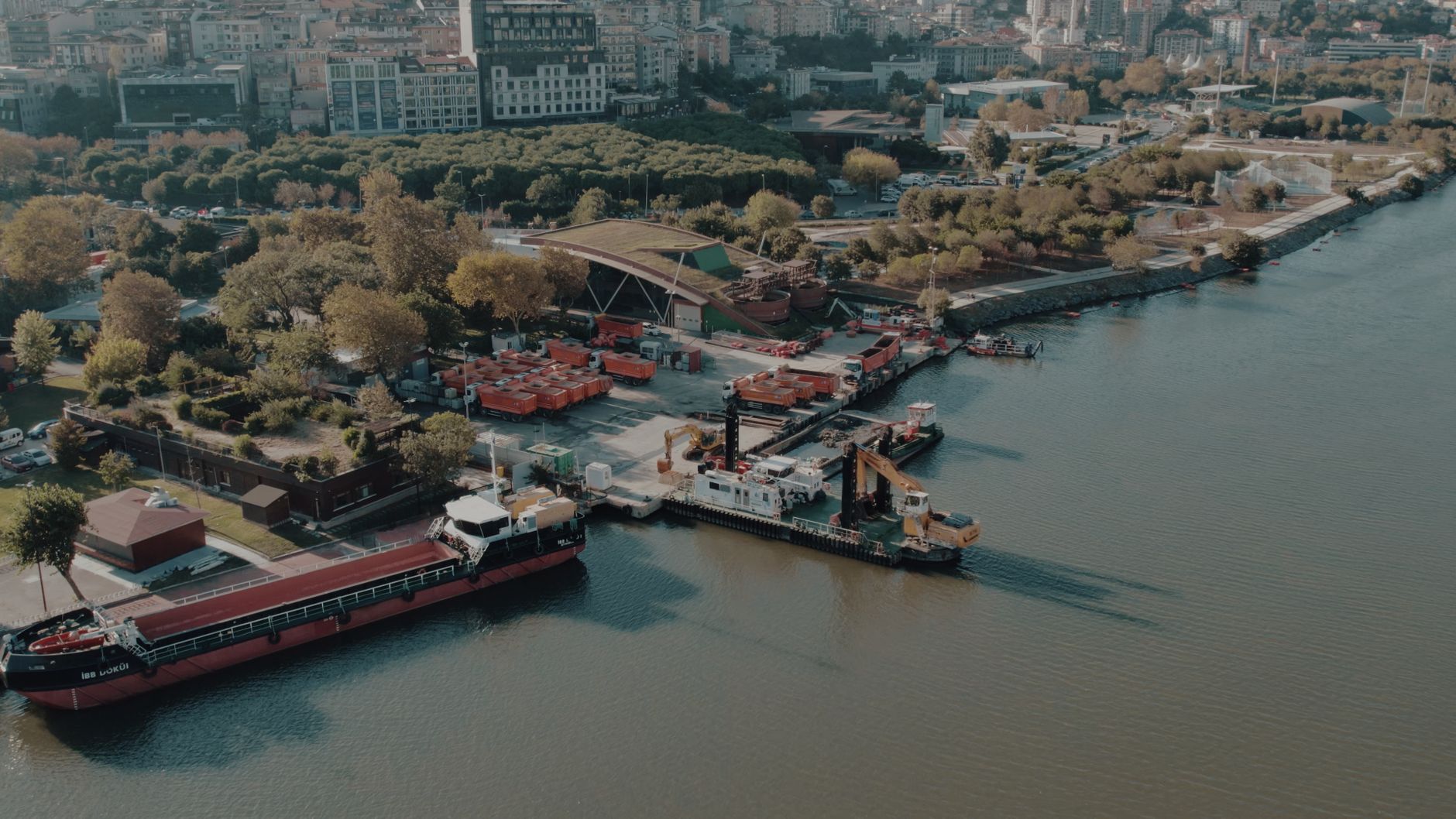 Aerial shot of Istanbul waterfront showing ships docked along a lush green shoreline. — Play Store Not Downloading Apps? Here