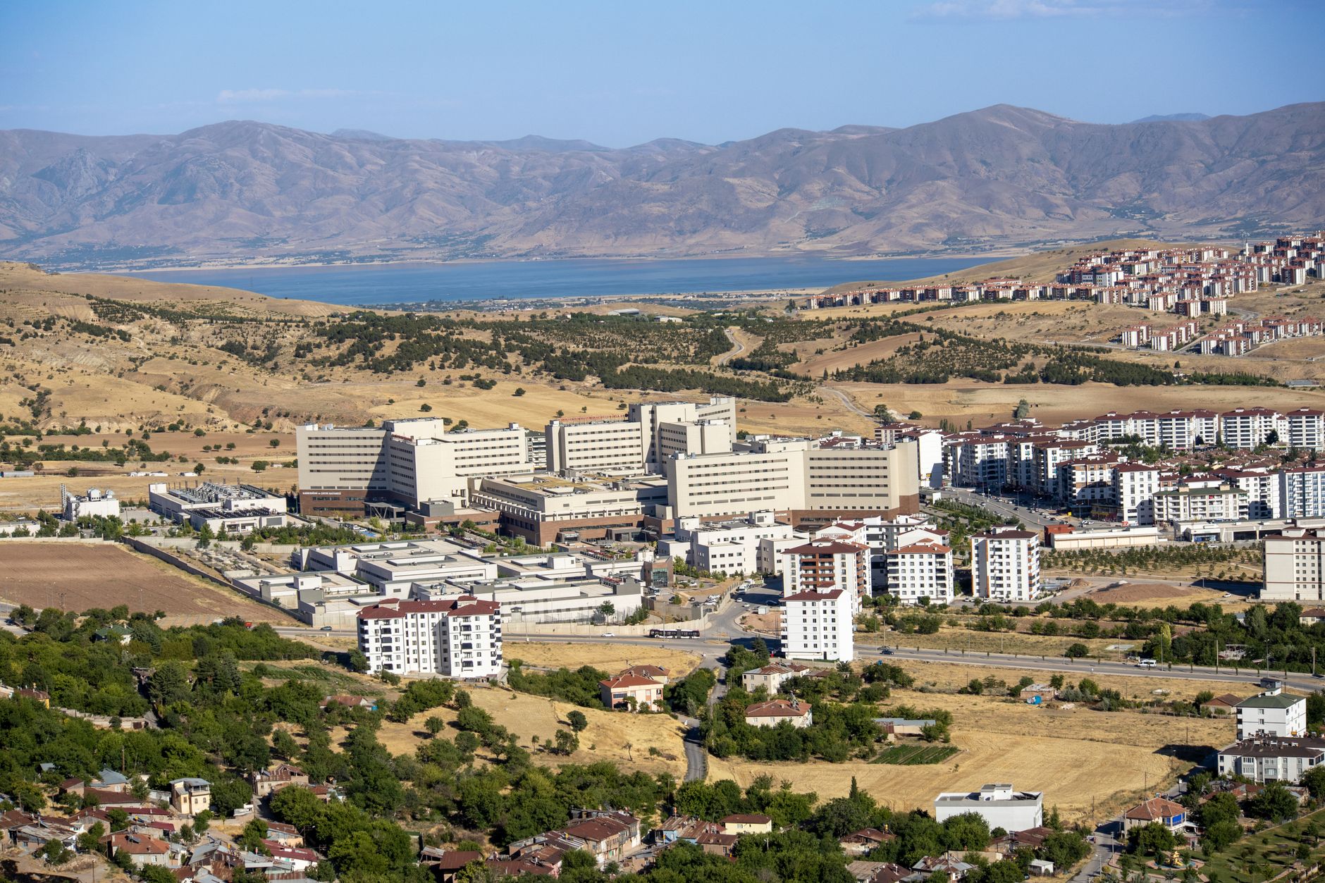 Stunning aerial photograph capturing the expansive cityscape of Elâzığ, Türkiye, with distant mountains. — Get Reward