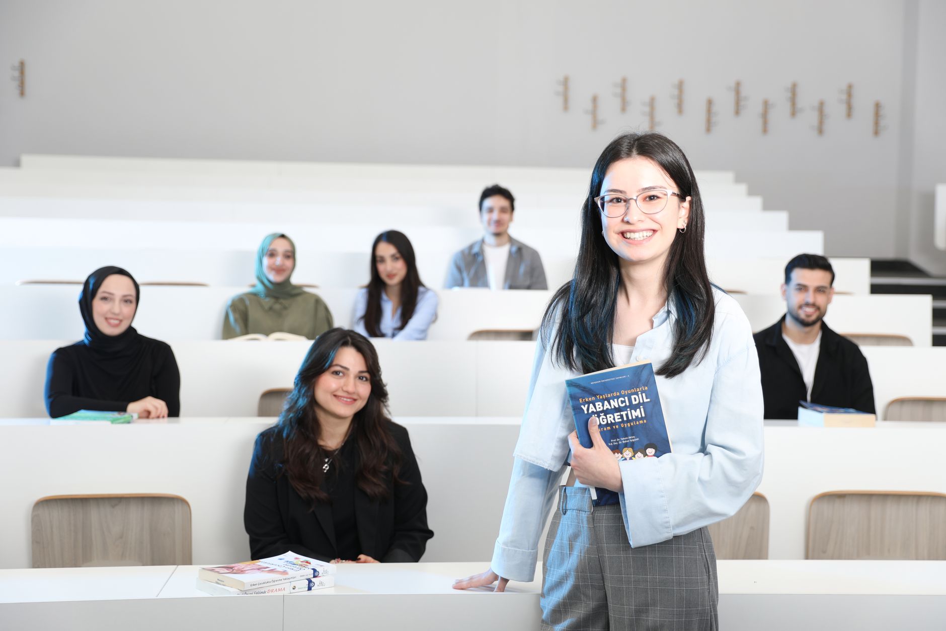 Group of diverse university students in a bright lecture hall, studying language education. — The Ultimate Guide To Online Da