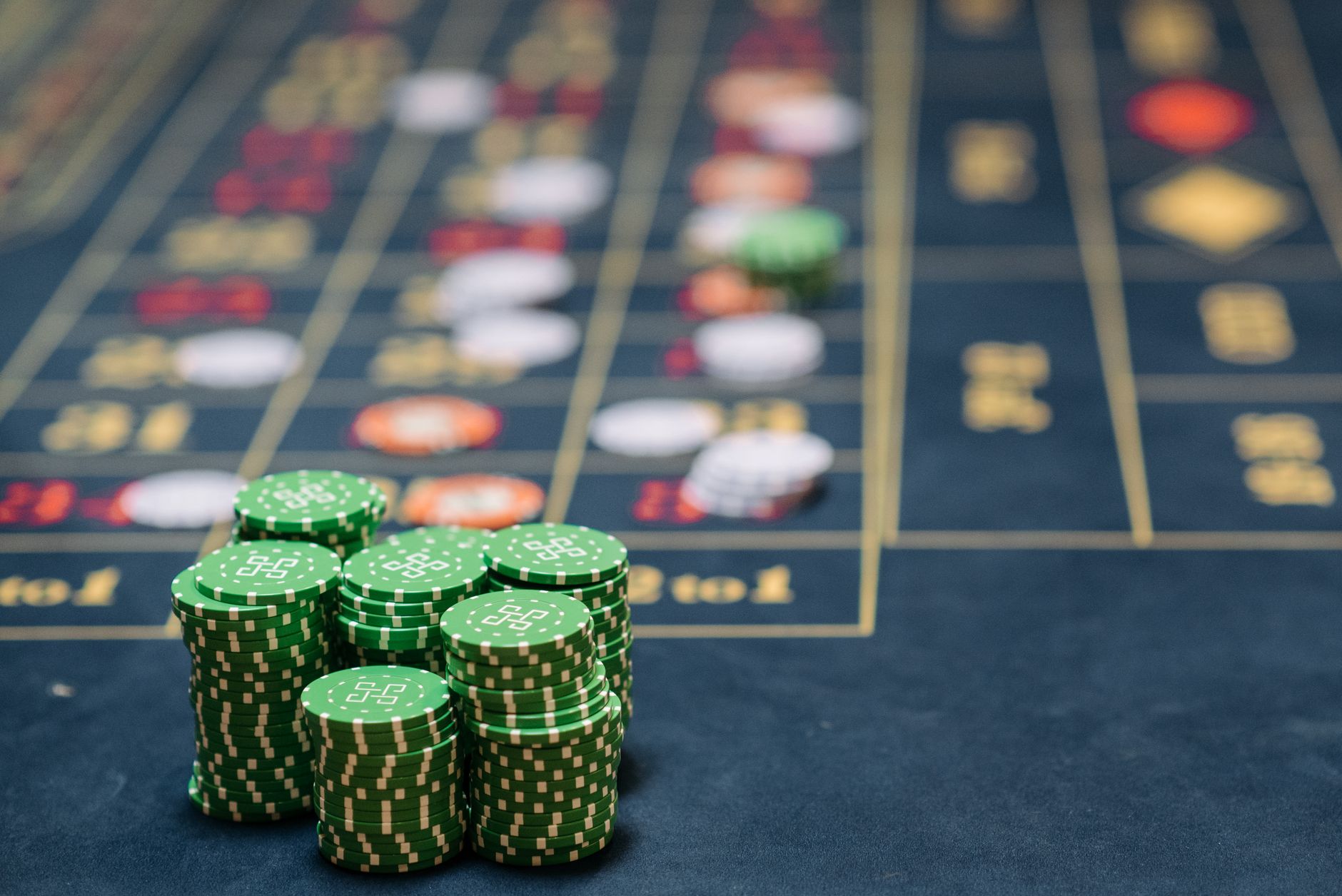 Stack of green poker chips on a casino table, highlighting the gambling theme. — Trending Insight: Why Security, Speed, and T