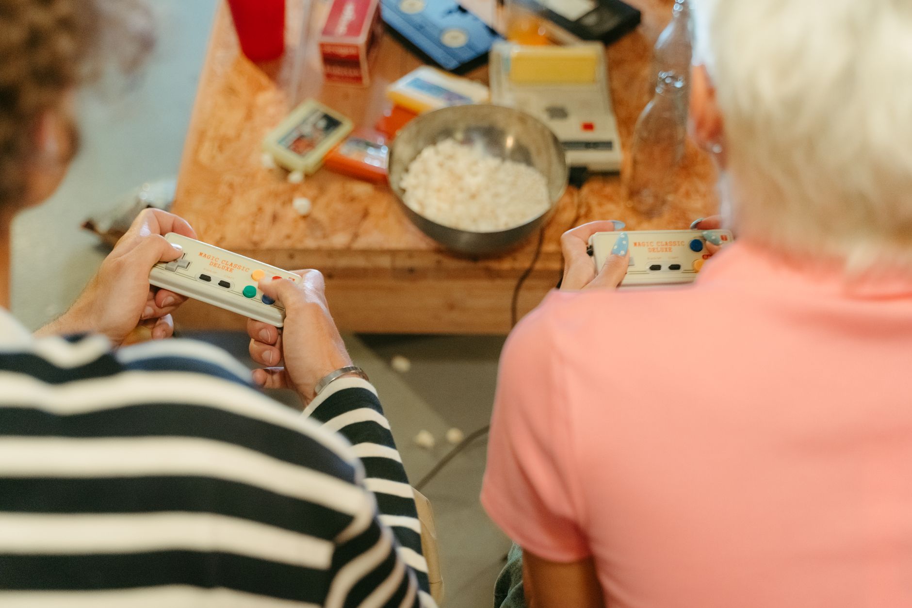 Two teenagers play video games together with snacks, creating a fun indoor atmosphere. — Which Internet Casino Will Be A Reli