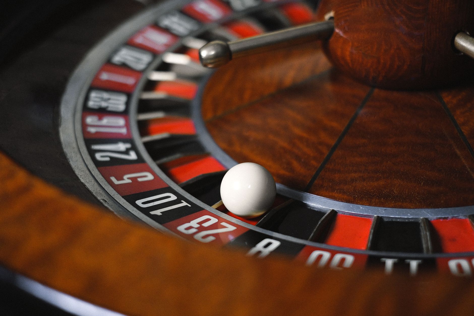 Detailed close-up image of roulette wheel highlighting numbers and spinning ball in a casino setting. — Why Do Lotto Fans Lov